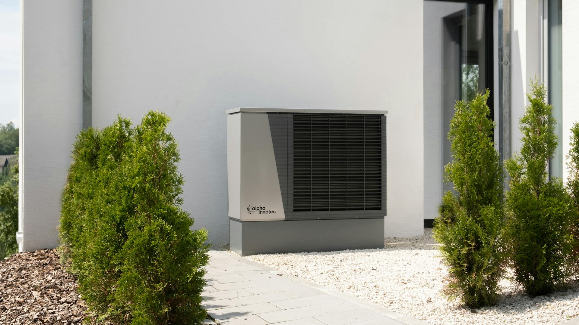 Heat pump unit installed on modern building exterior
